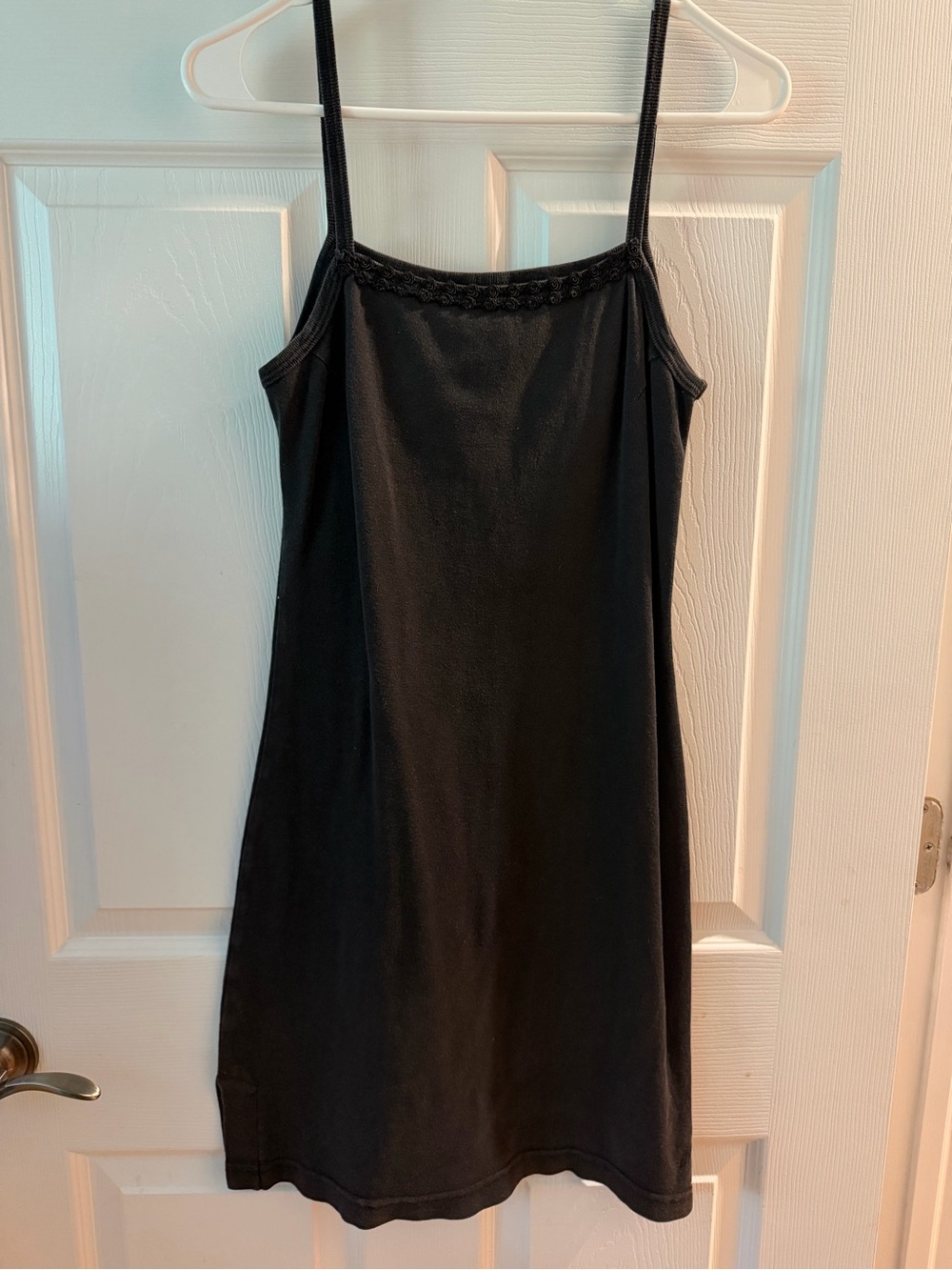 Classic Black Dress with Subtle Rose Detailing on Neckline